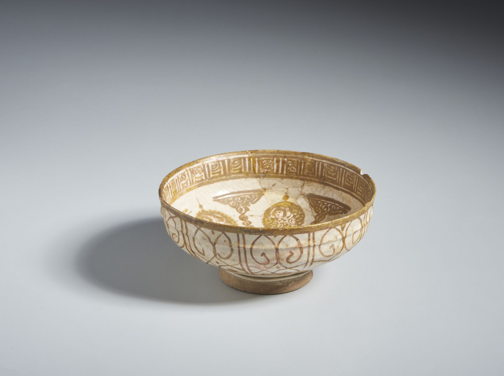 A lustre painted Kashan bowl Iran, Kashan, early 13th century Fritware body, lustre-painted in