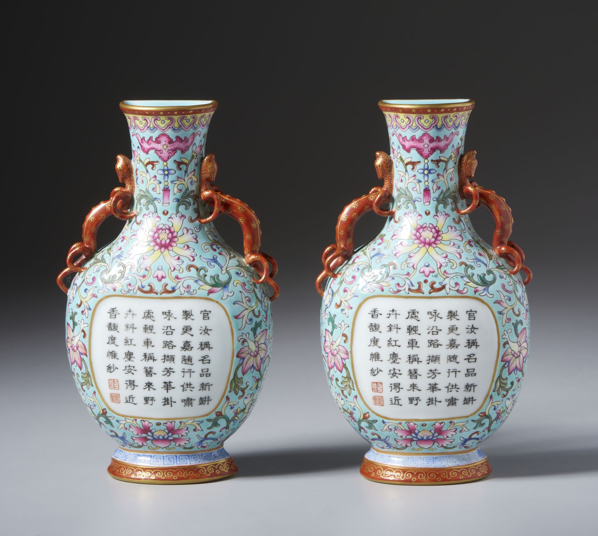 A pair of wall porcelain balauster vases with Qilong-shaped handles and central white reserve with