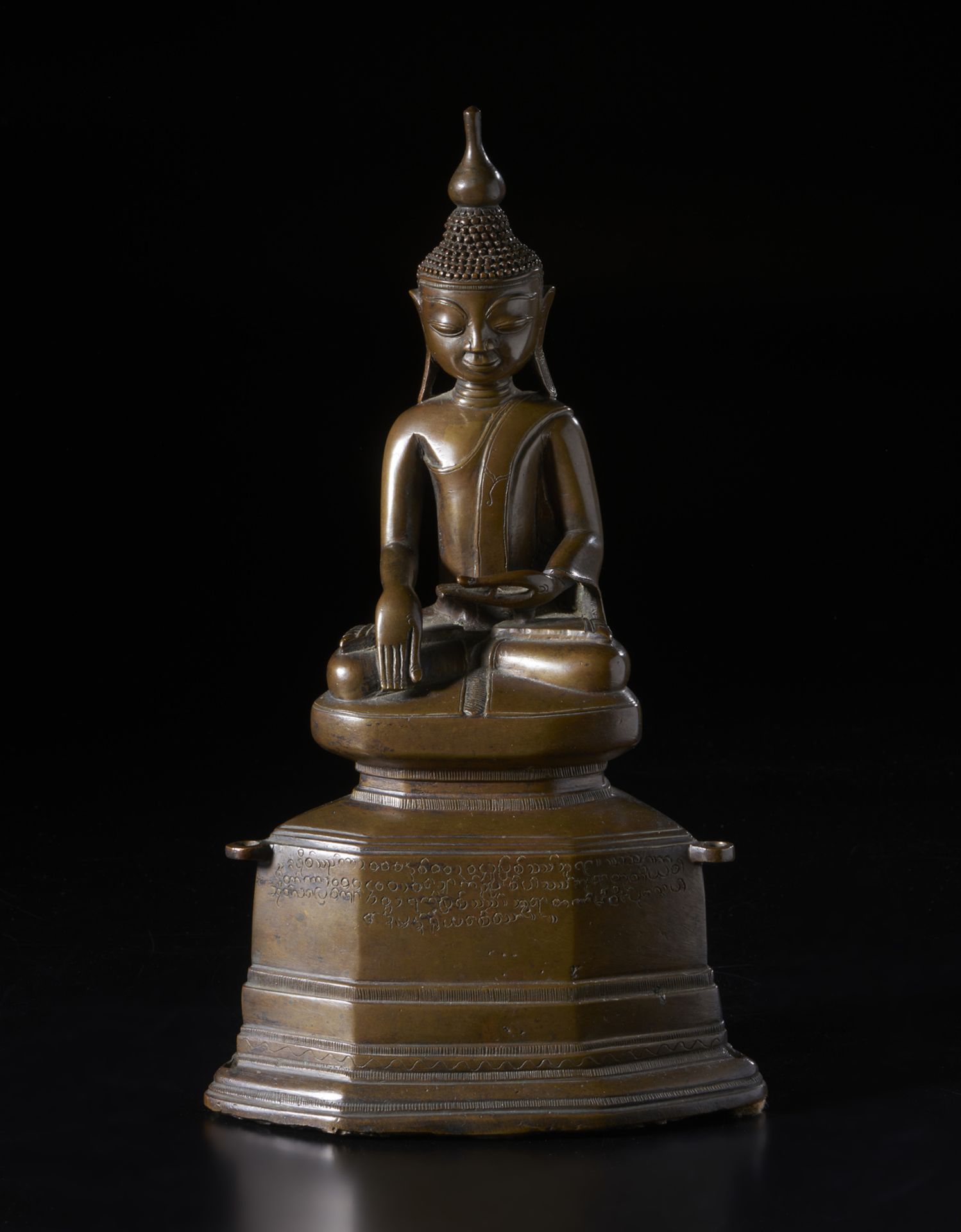 A bronze figure of Buddha Burma, 18th century Bronze casting depicting the historical Buddha