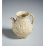 A fritware jug with pierced decoration Iran, Kashan, 12th century Restored. Cm 9,00 x 11,30