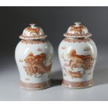 A fine and impressive pair of porcelain iron red “Pho dogs” storage jars . China, Qing, 19th century