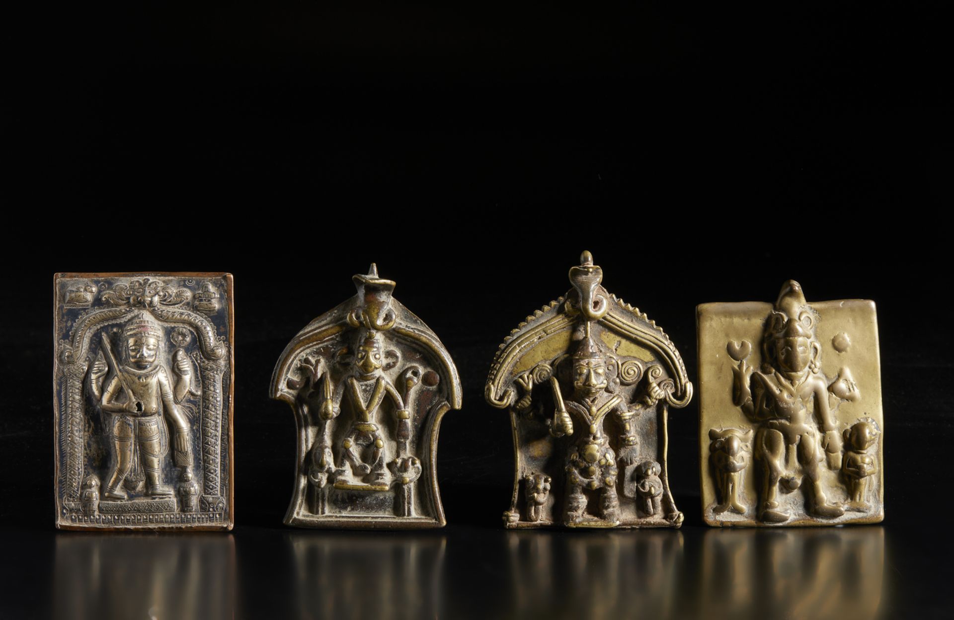 A group of 4 Virabhadra plaques Southern India, 19th century Including: 3 cast brass plaques and one