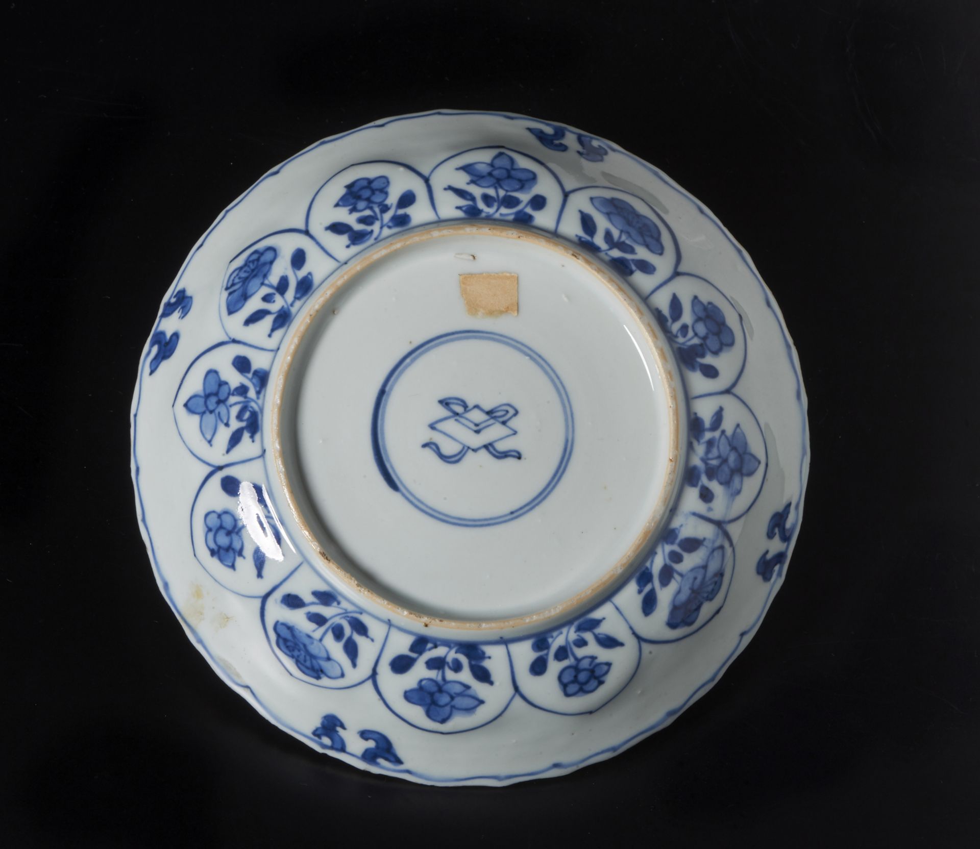 A blue and white porcelain dish China, Qing, Kangxi mark and perioddecorated with floral scrolls, - Image 3 of 3