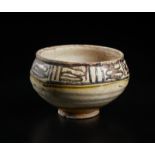 A terracotta slip painted bowl with pseudo inscription Iran, 10th century Cm 16,00 x 11,50