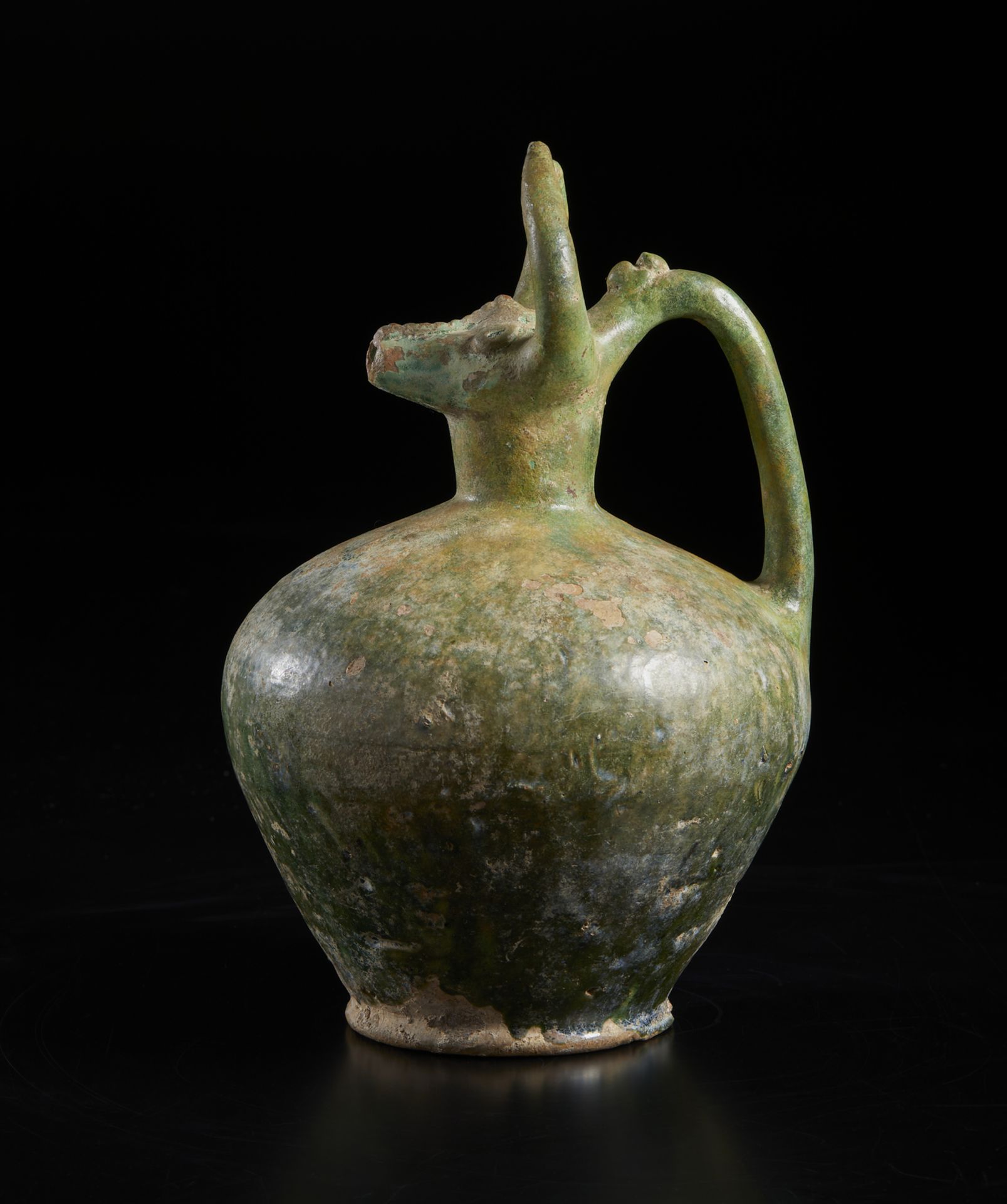 A bull (gav) headed green glazed pottery jug Iran, 12th century Of moulded fritware with a - Image 3 of 6