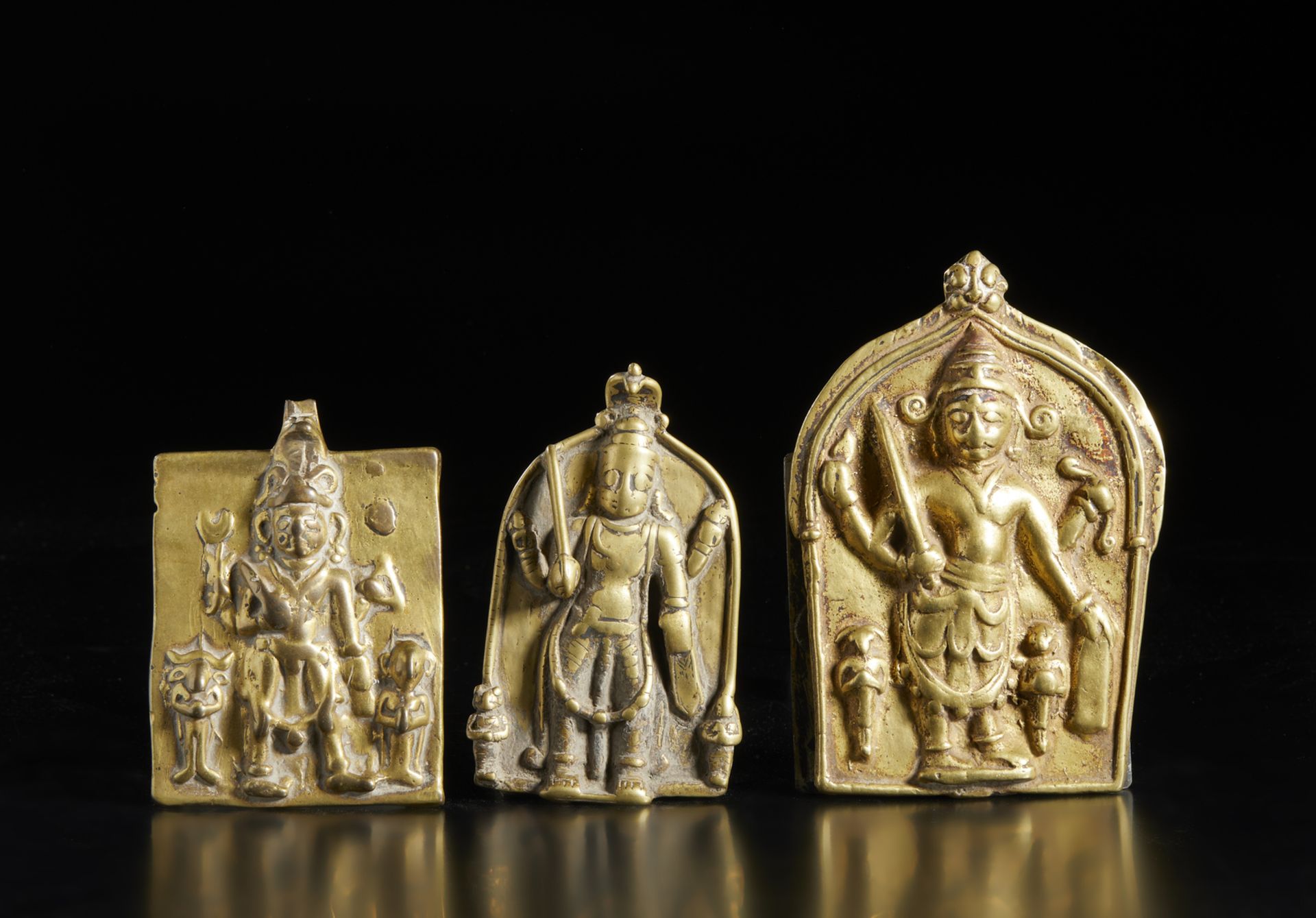 A group of three brass casting Virabhadra plaques Southern India, Tamil Nadu, 18th- 19th century The