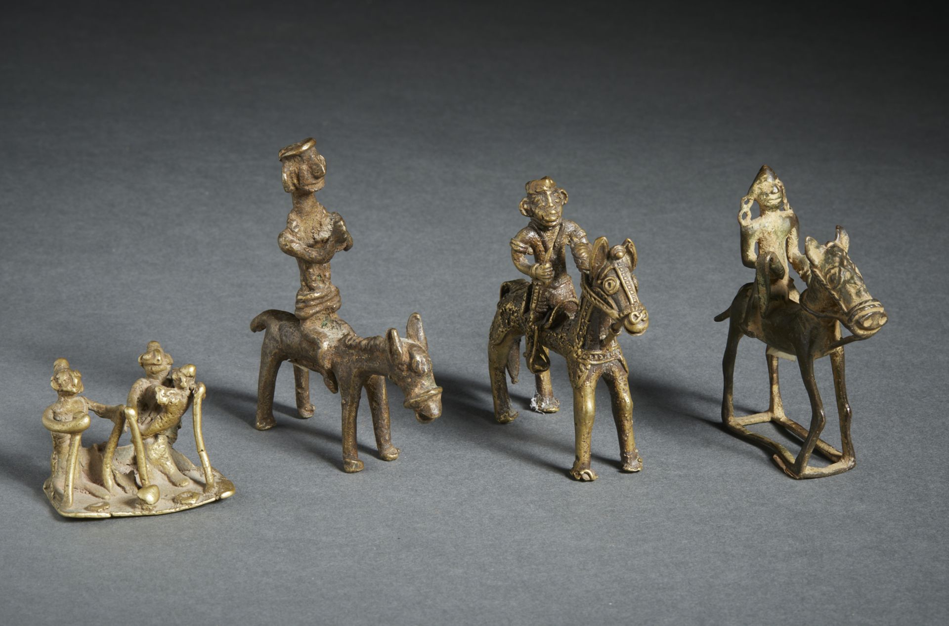 A group of 4 folk bronze figures Central India, 19th century Including: 3 riding Khandobas and a