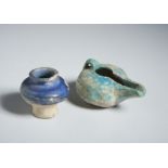 A blue glazed small vase and a turquoise glazed oil lamp Persia, 12th century Restored. Other