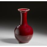 A sang de boeuf glazed porcelain vase China, 19th century Cm 15,00 x 24,00