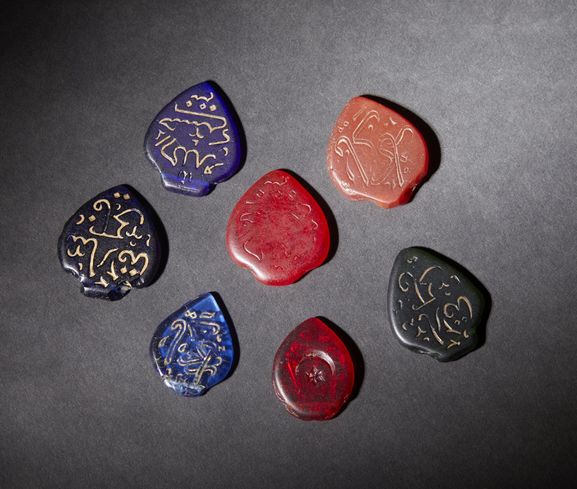 A group of 7 hard stone inscribed amulets Middle East, early 20th centuryThe size shown refers to