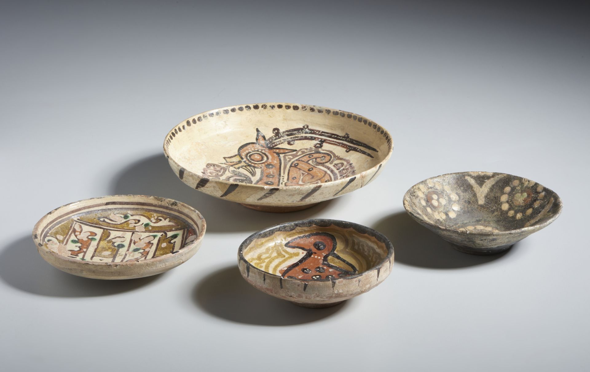 Group of 4 slip painted terracotta bowls Eastern Iranian World, 10th-11th century terracotta body,