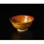 A jianyao amber-glazed bowl China, possibly Song dynasty, 12th centurythe ceramic body partially