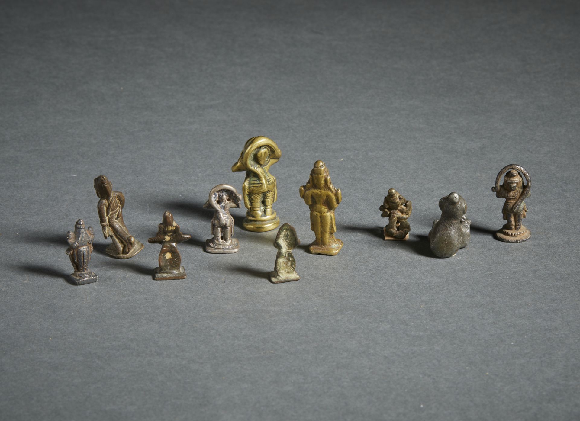 A group of 10 miniature devotional bronze figures India, 19th century The size shown refers to the - Image 2 of 2