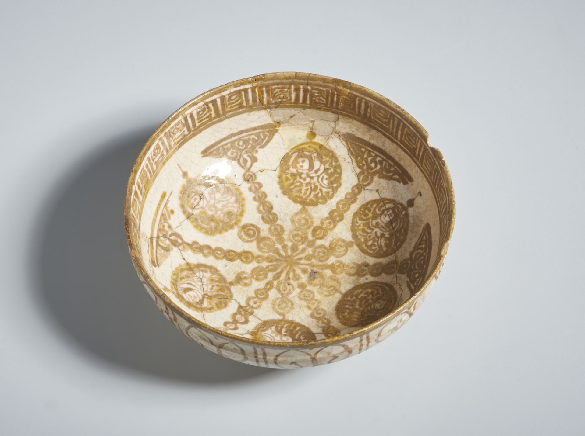 A lustre painted Kashan bowl Iran, Kashan, early 13th century Fritware body, lustre-painted in - Image 2 of 3