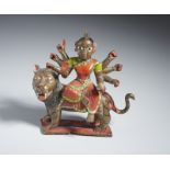 A polychrome bronze figure of Durga on a lion India, late 19th-20th century Cm 21,50 x 20,00