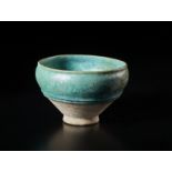 A large intact turquoise glazed pottery bowl Iran, Kashan, 12th century Cm 21,50 x 13,40