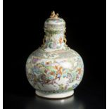 A famille rose porcelain bottle vase and cover China, Qing dynasty, 19th century Bottle vase with