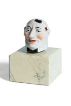 French porcelain head with built-in tape measure.