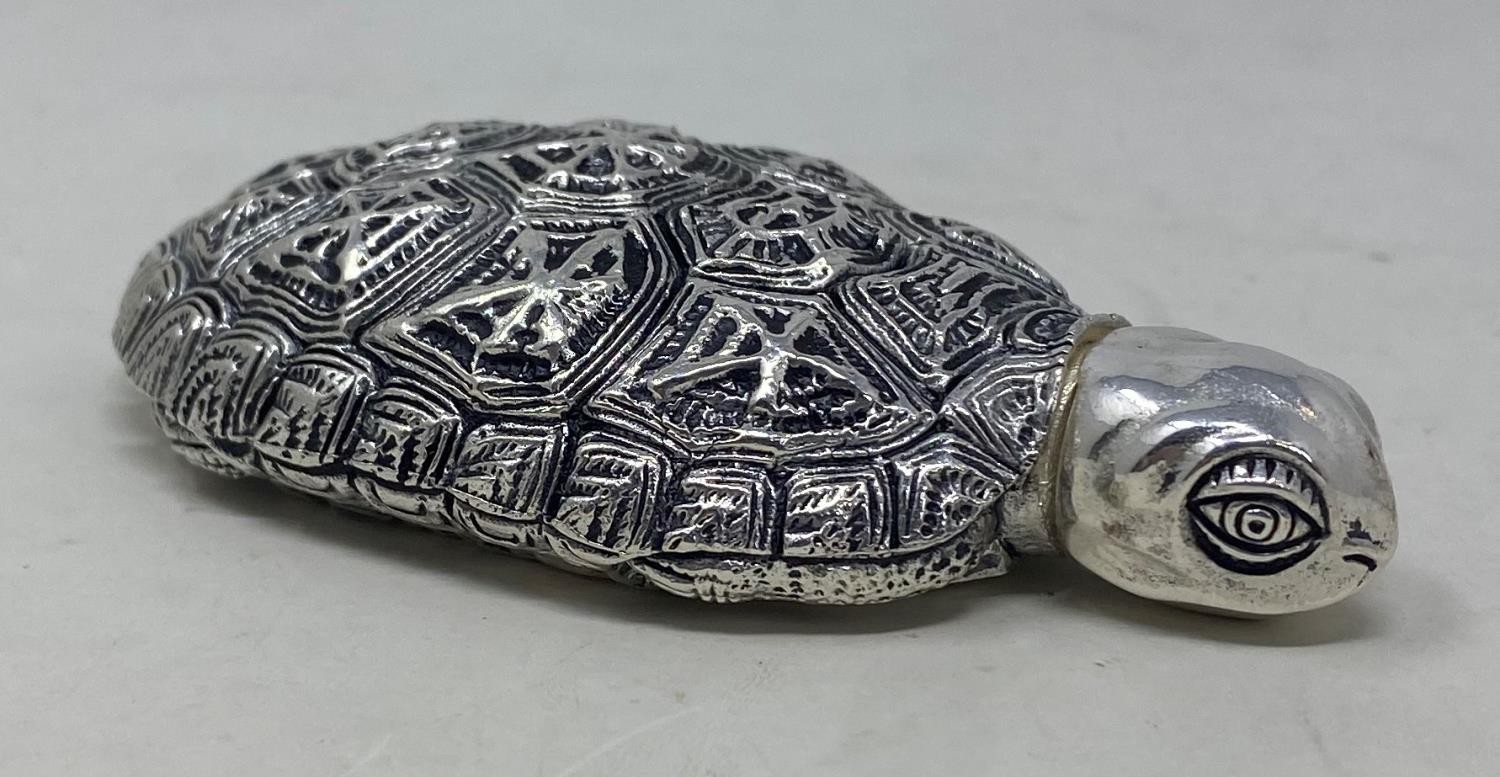 A novelty silver perfume bottle, in the form of a tortoise Condition good, a 20th/21st century copy