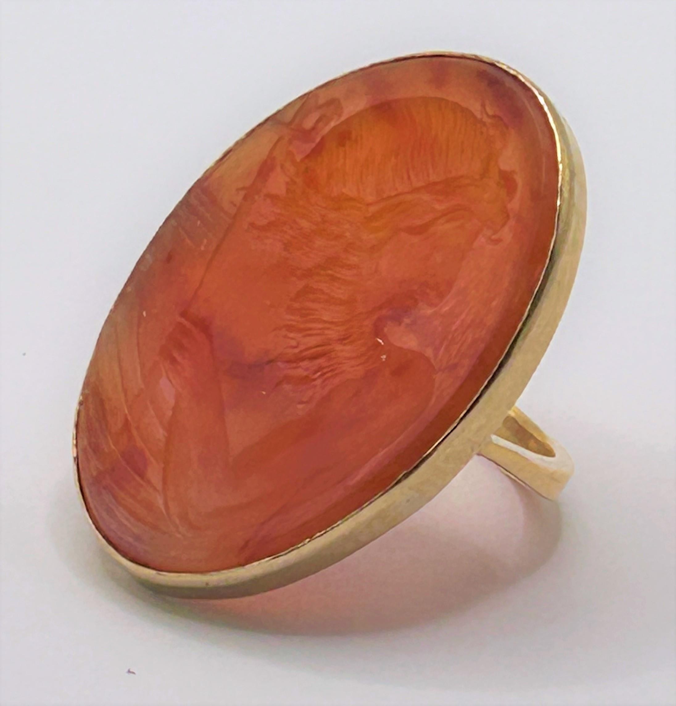A 9ct gold and carved red stone ring, ring size E The plaque 36 x 20 mm, subject is a bearded man