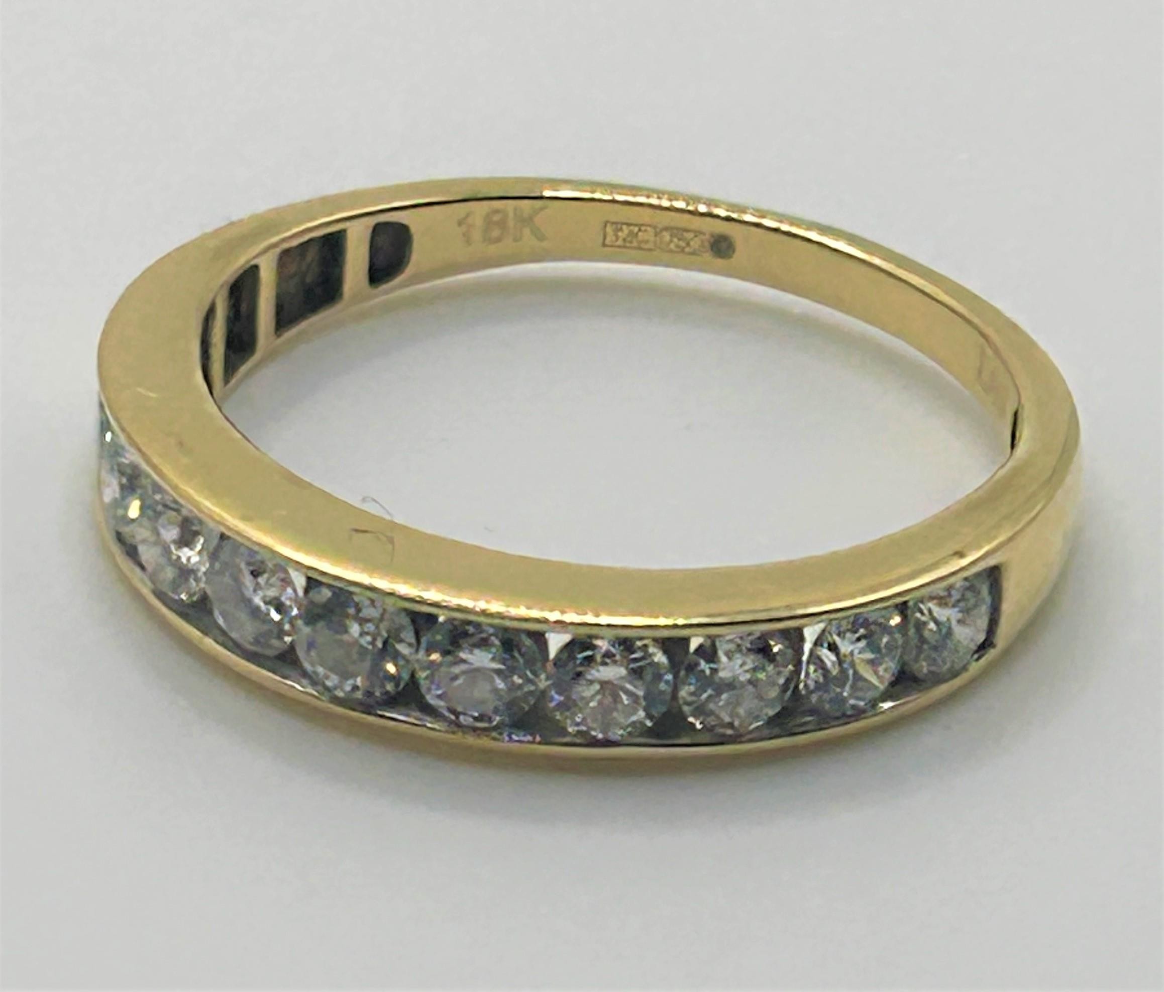 An 18ct gold and diamond ring, ring size S, with an International Gemological Institute