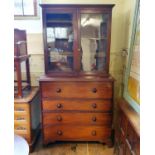 A mahogany bookcase cabinet, the top with two glazed doors, above a base of a secretaire drawer, and