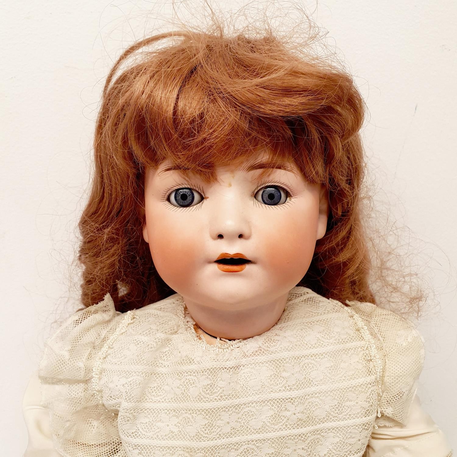 A Heubach German bisque headed doll, with a composite body, and millefiori glass eyes, 56 cm - Image 2 of 5