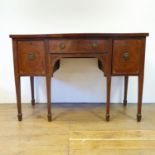 A 19th century mahogany serpentine sideboard, with a single drawer flanked by a cupboard door and