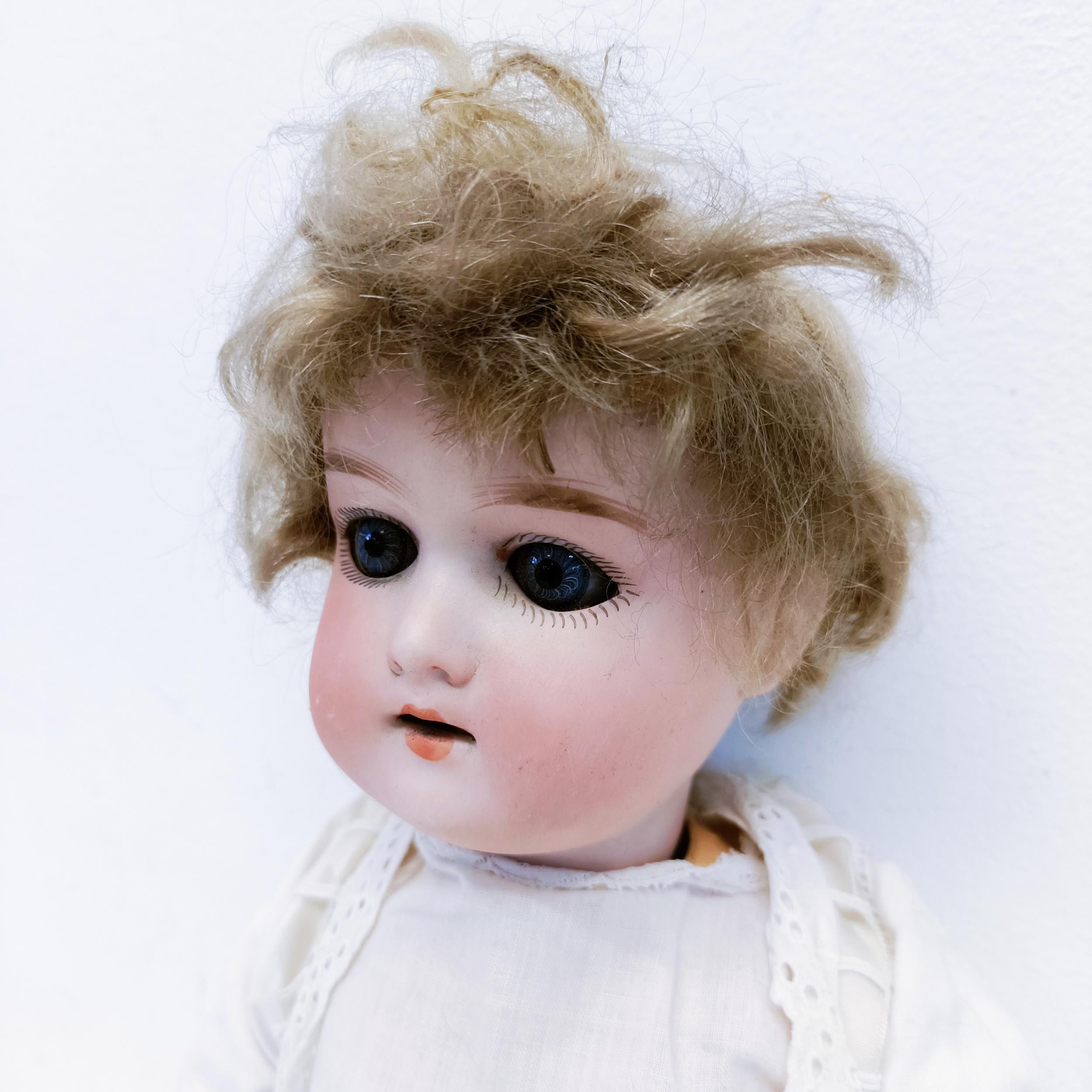 An Armand Marseille German bisque headed doll, with a jointed composite body, millefiori glass eyes, - Image 2 of 4