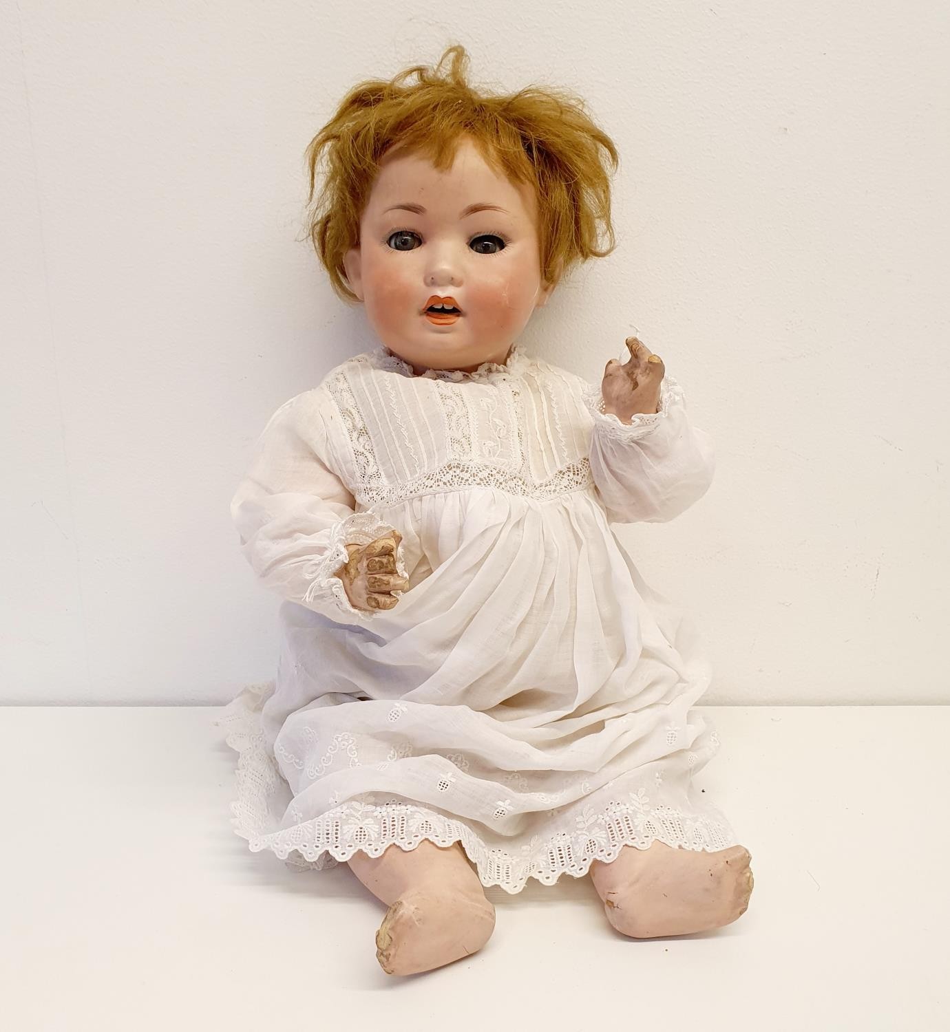 A German bisque headed doll, maker mark PM No 914, composite body, with millefiori closing glass