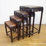 A Chinese carved wood quartett, nest of four tables, the largest 72 cm high x 54 cm wide Slight