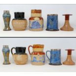 A Royal Doulton mug, with a silver mount, two Doulton jugs, a vase, and a candlestick (5) Mug no