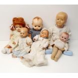 A 1940s composition baby doll, 44 cm, and five other dolls (box) Provenance: From a vast single