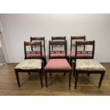 A set of six 19th century mahogany bar backed dining chairs, with drop in seats on turned tapering