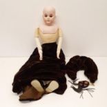 An Armand Marseille German bisque headed doll, No 3200, with a cloth, leather and bisque body, 60 cm
