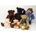 A Little Folk brown teddy bear, 71 cm, another in black, a Paddington Bear, a Harrods bear, and