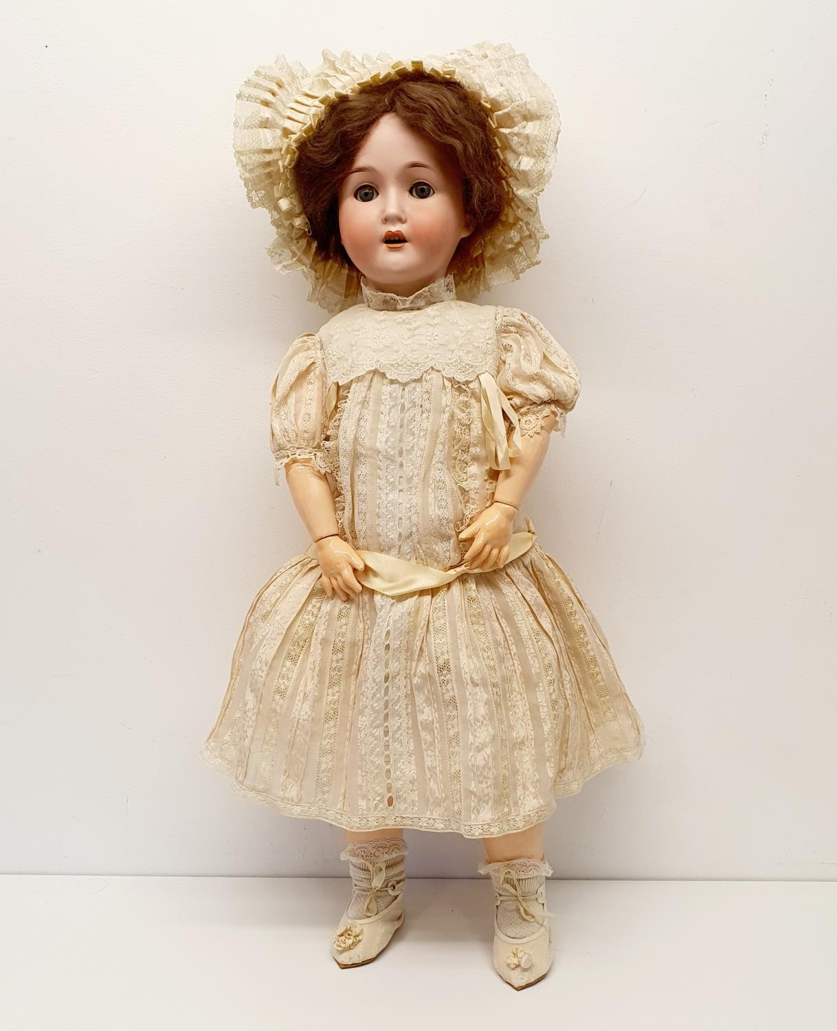 A Trebor German bisque headed doll, No 22, with a composite joined body, and closing millefiori