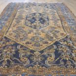 A Persian blue ground rug, 187 x 124 cm