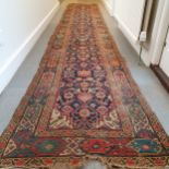 A Persian blue ground runner, 500 cm x 79cm Very worn, some losses