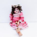 An Armand Marseille German bisque headed doll, No 39ON, jointed composite body, closing millefiori