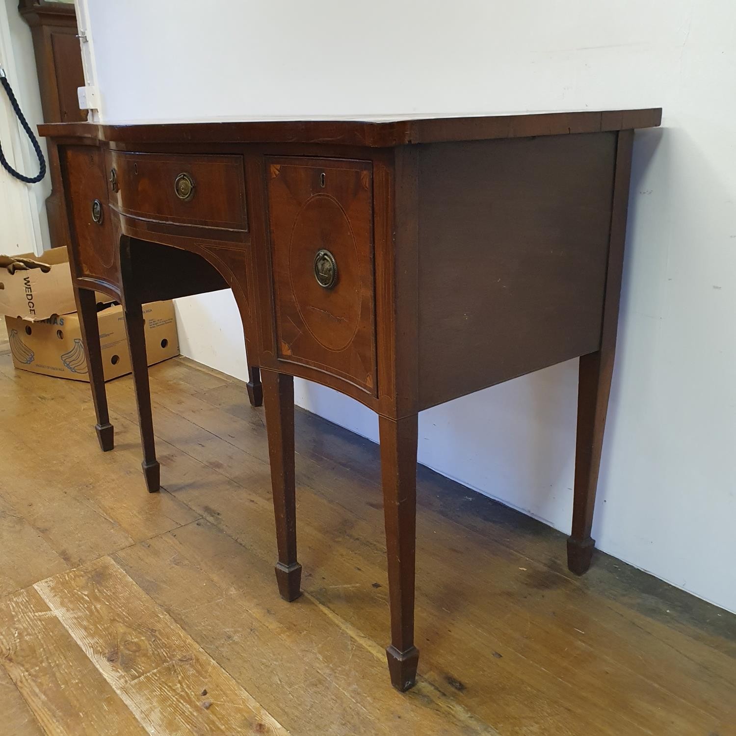 A 19th century mahogany serpentine sideboard, with a single drawer flanked by a cupboard door and - Image 7 of 7