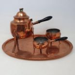 A Scandinavian copper tea set, comprising a kettle, milk jug, sugar bowl and an oval tray, 45 cm