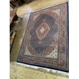 A Persian style blue ground carpet, with multiple borders, 338 x 250 cm Overall condition good,