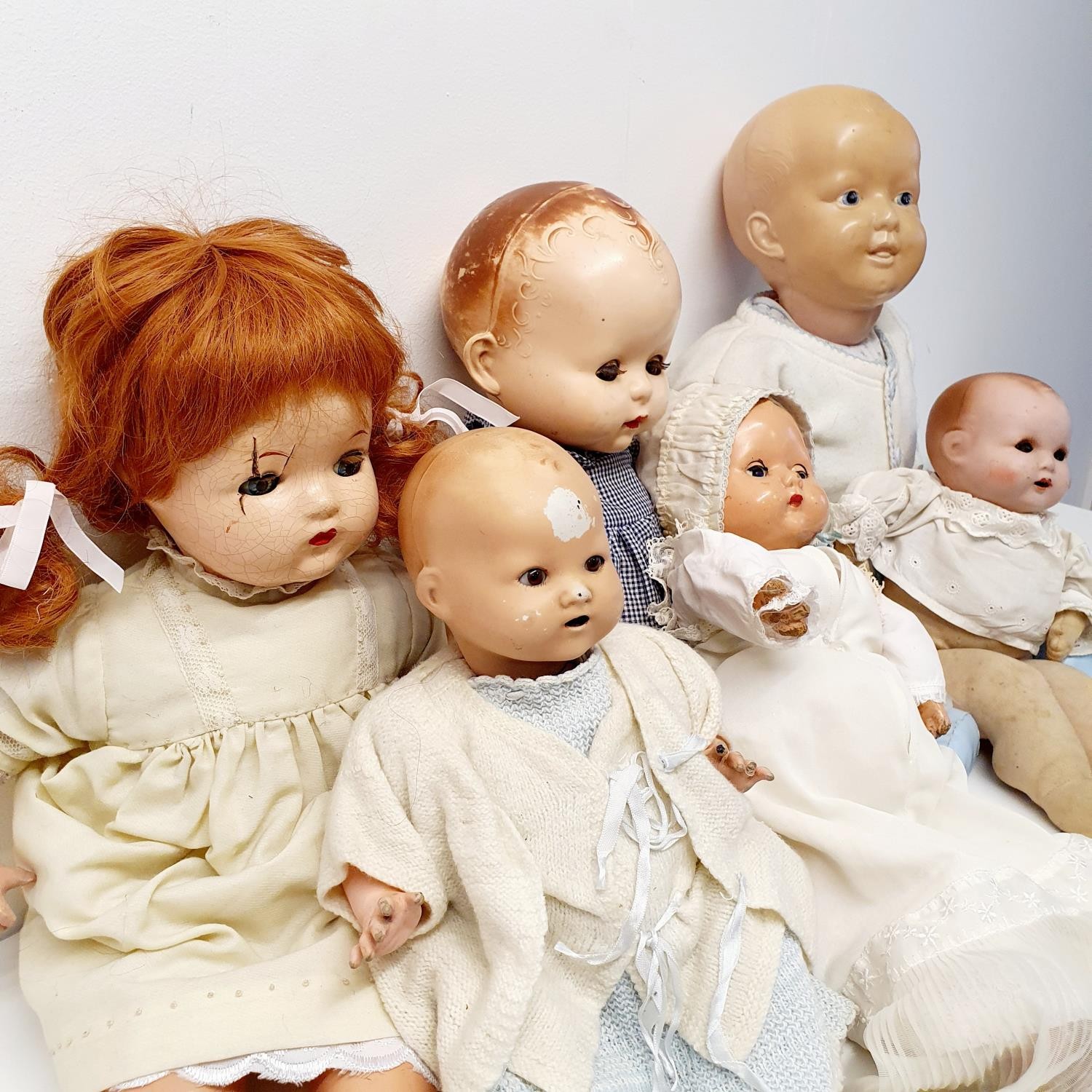 A 1940s composition baby doll, 44 cm, and five other dolls (box) Provenance: From a vast single - Image 3 of 5