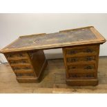 An early 20th century oak pedestal desk, having eight drawers, 150 cm wide Desk in need of extensive