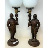 A pair of carved wood figural lamps, 60 cm high (2)