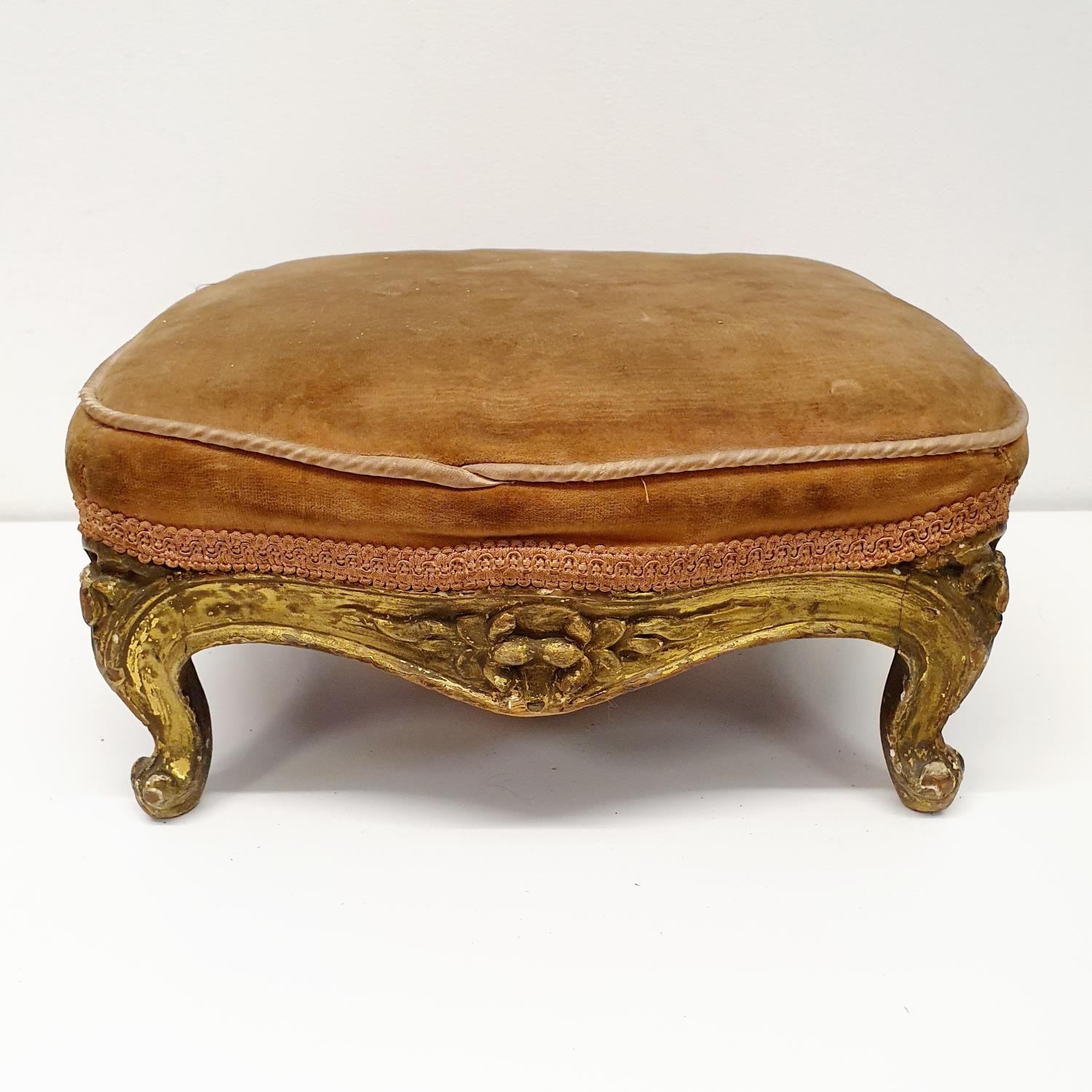 A carved giltwood footstool, with a VR type cypher, 36 cm wide, and another, 34 cm wide (2)