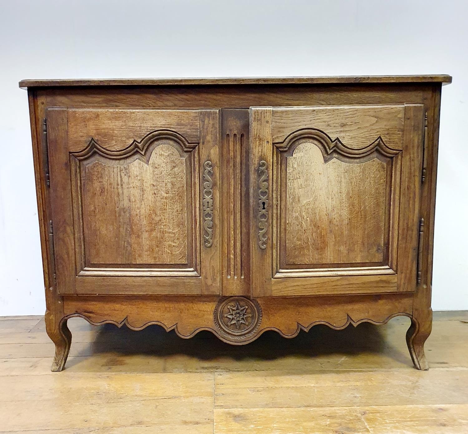 A French oak buffet, with two cupboard doors on cabriole legs, 31 cm wide