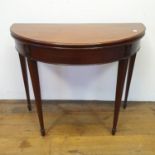 A 19th century mahogany demi lune folding card table, on square tapering legs, 92 cm wide