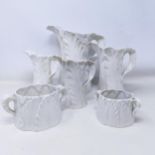A Royal Worcester set of four graduated leaf molded jugs, the largest 24 cm high, and two similar